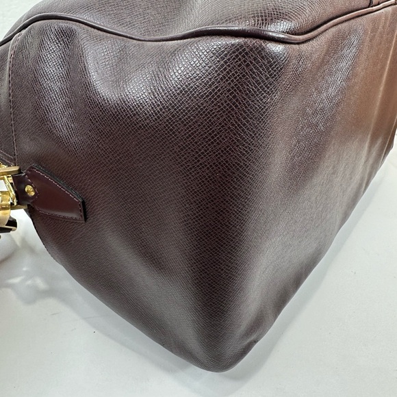 LV38 LOUIS VUITTON Taiga travel bag with strap - Picture 10 of 14